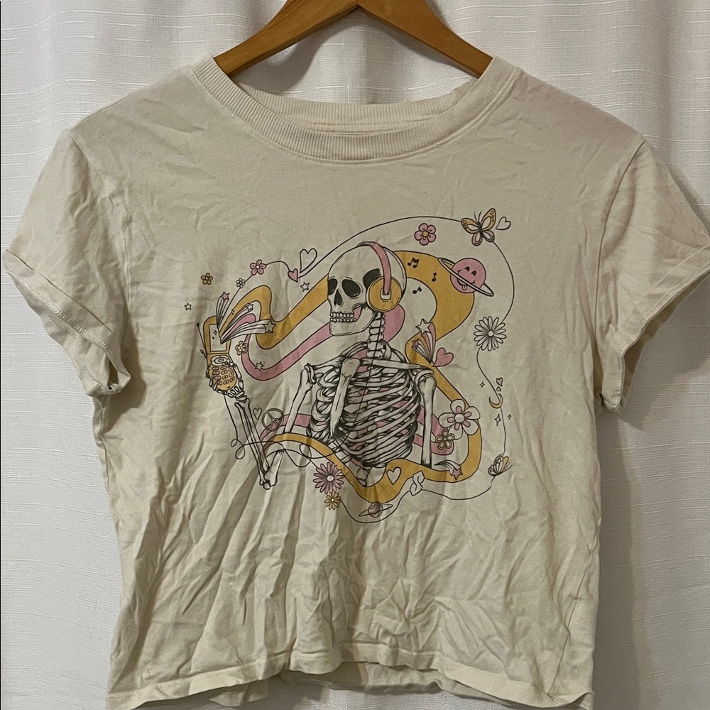American Eagle Outfitters Cream Crop Top with Skeleton Graphic
